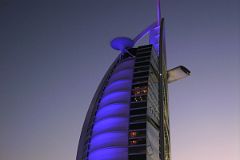 
After dark the translucent fiberglass wall of the Burj Al Arab in Dubai serves as a projection screen for a nightly light show. Here is a dusk view from the beach of the Jumeirah Beach Hotel. 
